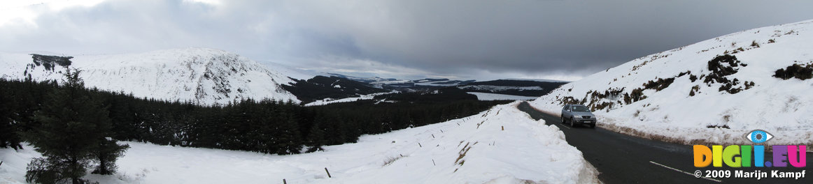 SX02508-02513 Car driving through snowy Wicklow mountains